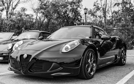 Chicago, Illinois - September 29, 2024: 2015 Alfa Romeo 4C Coupe black color. P2015 Alfa Romeo 4C Coupe parked on the street. corner view. 2015 Alfa Romeo 4C Coupe in Chicagoのeditorial素材
