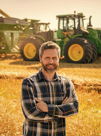 Man farmer check agriculture field harvest. Man agronomist farmer. Crop protection. Agriculture farm. Farm man at wheat field. Crop harvest and farming. Farmer in field. Rural manの写真素材