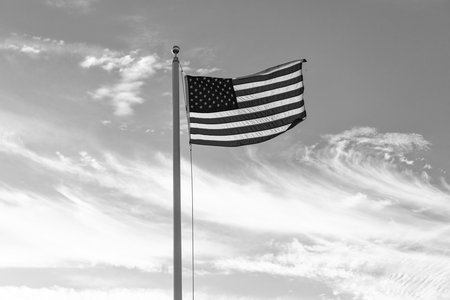 Flag of the USA. National waving flag of united states on blue sky. Independence day. Patriotic symbol. American Flag for Memorial Day or 4th of July. American flag. Day of independenceの写真素材