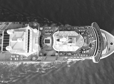 Aerial view of luxury liner voyage. Ship top view. Luxury liner resort. Cruise ship voyage. Aerial top view of cruise in summer vacation. Cruise ship tour and travel at sea. Cruise departureの写真素材