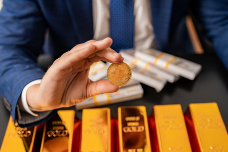 Bitcoin currency. Gold vs bitcoin digital money. Crypto savings. Financial success. Successful money saving in gold and bitcoin. Business man with gold bar. Golden bar value. Golden bar vs bitcoinの写真素材