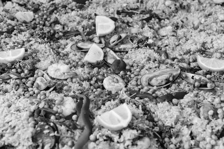 Paella seafood. Spanish cuisine. Traditional rice seafood paella. Dish of Spain, seafood paella background. Spanish paella with shrimps, culinary recipe. Rice food dish. Rice risottoの写真素材