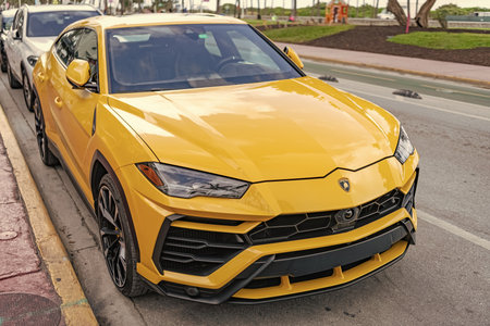 Miami, Florida, USA - December 15, 2024: yellow Lamborghini Urus 2019 SUV car. Luxury car of Lamborghini Urus SUV type. Car of Lamborghini Urus parked outdoor. Lamborghini Urus, side view.のeditorial素材