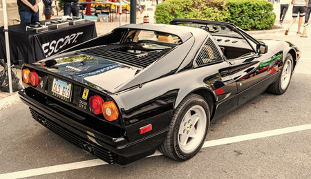 Chicago, Illinois - September 29, 2024: Classic Ferrari 328 GTS black color. Vintage Ferrari 328 GTS parked on the street. back view. Retro Ferrari 328 GTS in Chicagoのeditorial素材