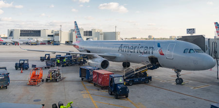 Los Angeles, California, USA - April 29, 2025: Airport terminal service. Plane arrival American airline. Departure and arrival at airport. American airlines group plane departure in airportのeditorial素材