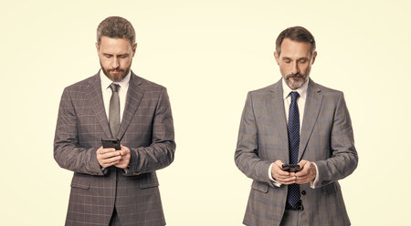 businessmen reading or texting instant message on phone isolated on white