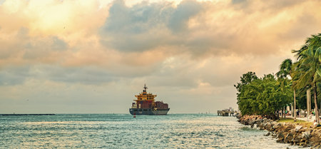 Miami, Florida, USA - December 16, 2024: Cargo Chloe D Monrovia ship with container, aerial view....