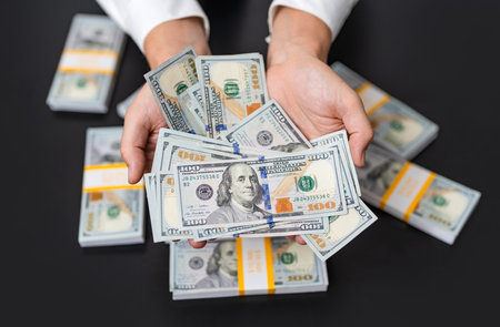 Financial saving success. Successful rich man with money. Business success man hold dollar. Millionaire hold dollar money. Riches and success. Rich businessman saving cash money. Dollar balanceの写真素材