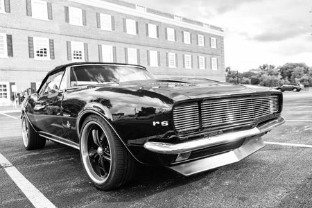 Park Ridge, Illinois, USA - August 18, 2024: Chevy Camaro. Black car parked at auto show, corner view. Chevrolet Camaro SS 1967 car. Black car of Chevrolet Camaro SS.のeditorial素材
