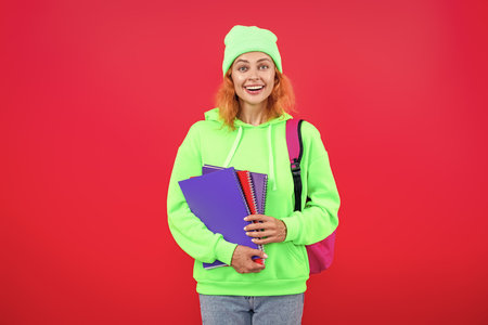 Education in university. Woman isolated on pink. September 1. Knowledge and education. School...