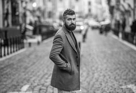 Business man in urban city. Stylish businessman crossing the street, stylish menswear. Urban style....
