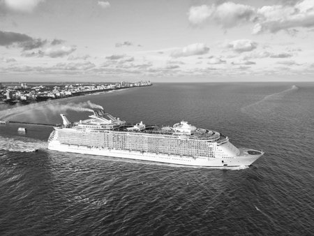 Cruise ship voyage. Aerial view of cruise in summer vacation. Cruise ship tour and travel at sea. Aerial view of luxury liner voyage. Ship leaving Miami beach port. Miami tour. Cruise entertainmentの写真素材