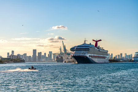 Miami, Florida, USA - December 24, 2024: Sunrise cruise ship voyage. Cruise in summer vacation. Cruise ship tour and travel at sea. Ship departing Miami portの写真素材
