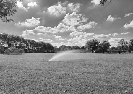 Football field irrigation. Irrigation turf. Sprinkler watering football field. System working...