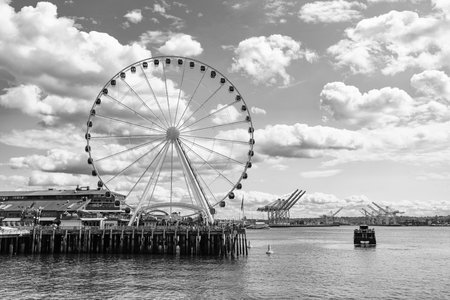 Seattle, Washington, USA, July 26, 2024: Ferris wheel. Amusement park with Ferris wheel. Observation Ferris wheel. Fairground ride on observation wheel. Entertainment park. Copy spaceのeditorial素材
