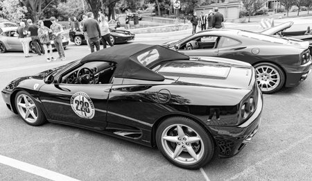 Chicago, Illinois - September 29, 2024: Ferrari 360 Spider black color. Ferrari 360 parked on the street. corner view. Luxury Ferrari 360 in Chicagoのeditorial素材