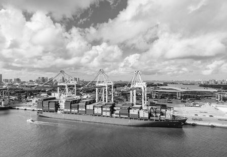 Miami, Florida - February 12, 2025: Aerial Miami port with cargo container. Export and import. Port of Miami. Cargo ship loaded with container in Miami, aerial. Freight container. Cargo terminalのeditorial素材