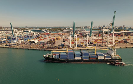 Miami, Florida, USA - March 20, 2025: Miami port. Container ship. Cargo Warnow Whale Limassol ship...