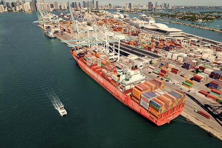 Miami, Florida, USA - March 20, 2025: Cargo ship vessel. Miami port. Container export ship. Cargo...