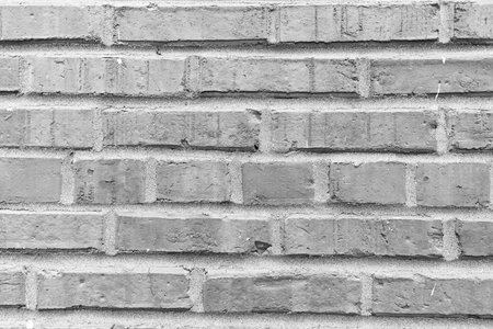 Textured brown backdrop. Wall texture background. Brick wall structure. Brick masonry background. Building material concept. Surface of brickwall. Vintage brick backdropの写真素材