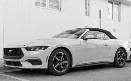 Miami, Florida, USA - December 15, 2024: yellow 2024 Ford Mustang EcoBoost convertible car. Luxury...