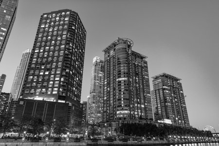 Skyscraper in city downtown. City downtown architecture. Office building in business district. Modern glass building. Chicago city. Skyscraper building architecture. Business skyscraper of glassの写真素材