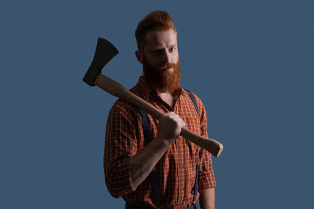 Bearded man hold ax. Hair and beard care. Handsome bearded man. Beard styling with axe. Caucasian...