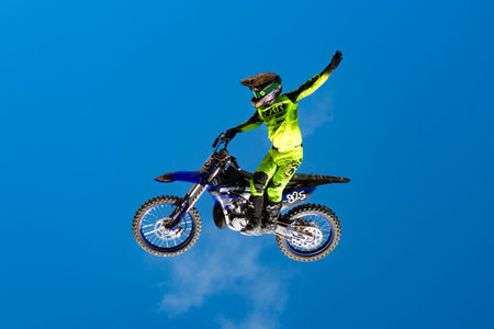 Miami, Florida, USA - May 25, 2025: Motion and extreme sports energy. Motocross rider performing stunt. Freestyle motocross FMX. Professional rider at FMX Freestyle Motocross competitionのeditorial素材