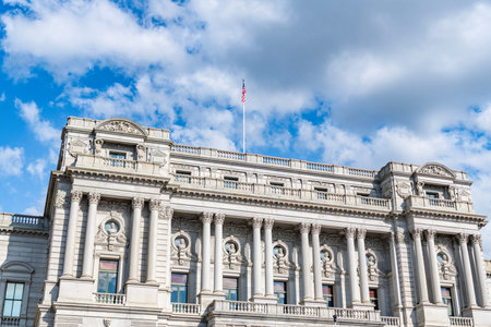 American flag above the Congress library. USA Congress. Congress historic symbol of American democracy. Washington monument architecture. Iconic Congress libraryの写真素材