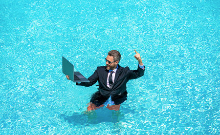 Successful business man on summer vacation. Remote working. Summer business vacation. Funny...