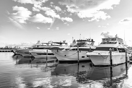 Luxury yacht marina. Docked luxurious yacht boat. Luxury lifestyle. Motorboat at sea. Boating charter. Luxury marina. Motorboat yacht sailing at sea. Yachting boat tourism. Motorboat sea marinaの写真素材