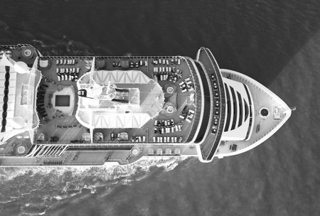 Cruise ship voyage. Aerial top view cruise in summer vacation. Cruise ship tour and travel at sea. Aerial luxury liner voyage. Top ship. Luxury liner resort. Beach area with sunbedの写真素材