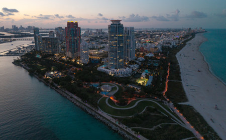 Miami Beach on blue sky. Skyline aerial view. Miami city. Tropical Miami scene. Miami district sky view. Famous oceanfront. Panoramic coastline. South beach panorama view. Summer holiday vibes.の写真素材