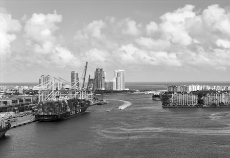 Miami, Florida - February 12, 2025: Aerial Miami port with cargo container. Export and import. Port of Miami. Cargo ship loaded with container in Miami, aerial. Freight container. Cargo terminalのeditorial素材