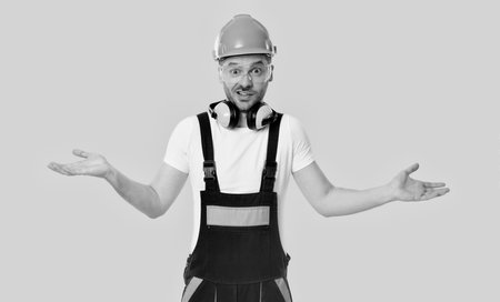Worker at construction site. Builder construction man. Builder engineer isolated on yellow....