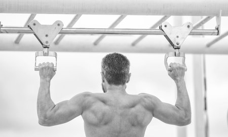 Muscular man sportsman with strong back muscle. Sport pullup workout. Sport training. Man sportsman...
