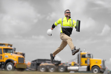 Engineer supervisor running outdoor. Supervisor jumping. Happy construction builder. Worker jumping...