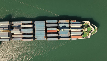 Cargo ship with container, aerial top view. Freight container on cargo vessel. Cargo ship vessel...