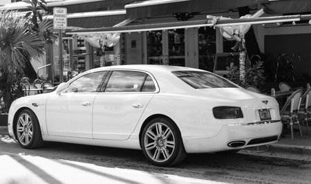 Miami, Florida, USA - December 17, 2024: 2016 Bentley Flying Spur V8 sedan car. Luxury car white Bentley Flying Spur V8 type. Car of Bentley Flying Spur parked outdoor. Bentley Flying Spur, corner view.のeditorial素材