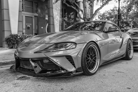 Miami, Florida, USA - November 26, 2024: Toyota Supra sportscar. Luxury sport car of Toyota Supra orange color. Car of Toyota Supra parked outdoor. Toyota Supra, low viewのeditorial素材