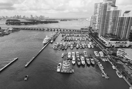 Docked yacht boat in harbor. Luxury summer vacation in Miami. Private boat view. Marina with luxury sea boat. Yacht club and marina in Miami. Luxury marina with private yacht and boat. Coastal marinaの写真素材