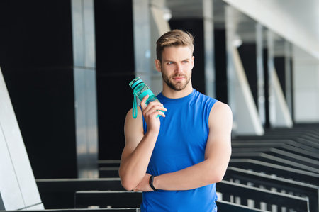 Hydration vitality. Be hydrated. Thirsty runner workout. Thirsty man drink water. Sport runner man has thirst. Healthy lifestyle. Water balance. Sport man thirst drinking water.の写真素材