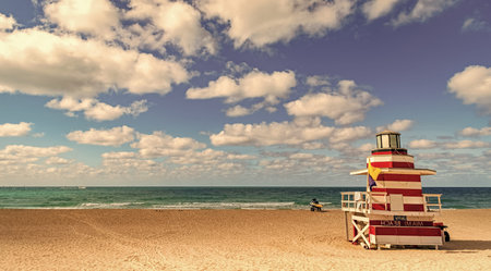 Miami pier. Jetty lifeguard tower on Miami Beach. Scenic view of Miami Beach coastline. Famous South Beach lifeguard. Tropical paradise in Miami. Art Deco lifeguard on Miamis beach.の写真素材
