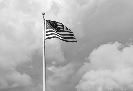 Flag of the USA. National waving flag of united states on blue sky. Independence day. Patriotic symbol. American Flag for Memorial Day or 4th of July. American flag. Day of independenceの写真素材