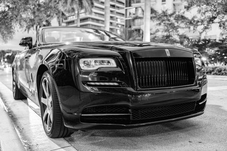 Miami, Florida, USA - November 19, 2024: 2020 Rolls Royce Dawn convertible car. Luxury car black Rolls Royce Dawn . Car Rolls Royce parked outdoor. Rolls Royce, front view.のeditorial素材