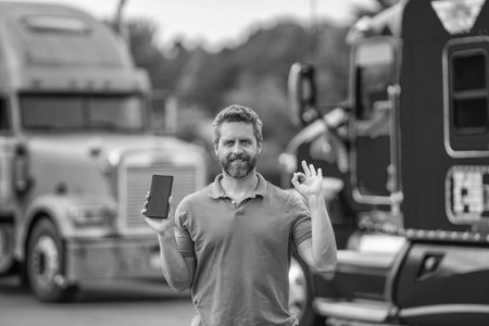 Trucking owner show phone app screen. Tech logistics. Hispanic truck man. Man owner truck driver....