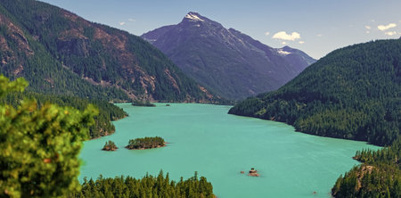 Lake with mountain landscape. Landscape of mountain peak and lake. Nature landscape. Lake in North...