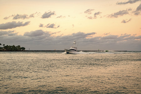 Fisher island building. Luxury motor boat yacht. Yacht go to marina. Boating and yachting. Luxury...