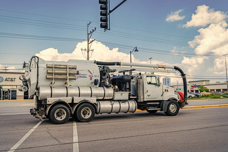 Park Ridge, Illinois, USA - August 17, 2024: 2006 Sterling L9500 Vactor 2112-J6 hydro excavation truck. Excavation truck of Sterling L9500. Truck of Sterling L9500 on road. Sterling truck, side viewのeditorial素材