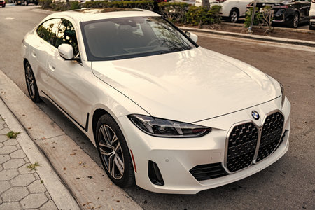 Miami, Florida, USA - April 13, 2025: Car BMW 4 coupe parked outdoor. White coupe car, corner top view. 2024 BMW 4 Series coupe car. Luxury coupe car BMW 4のeditorial素材